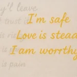 Handwritten phrases fading from gray into gold, replacing words like “They’ll leave” with affirmations such as “I’m safe” and “Love is steady.