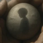 Close-up illustration of two hands holding a smooth stone with a faint child's silhouette reflected in it, in a Surrealist dreamscape (Dali-esque) style, representing EFT mentoring and why "unrelated" memories can matter in EFT practice.